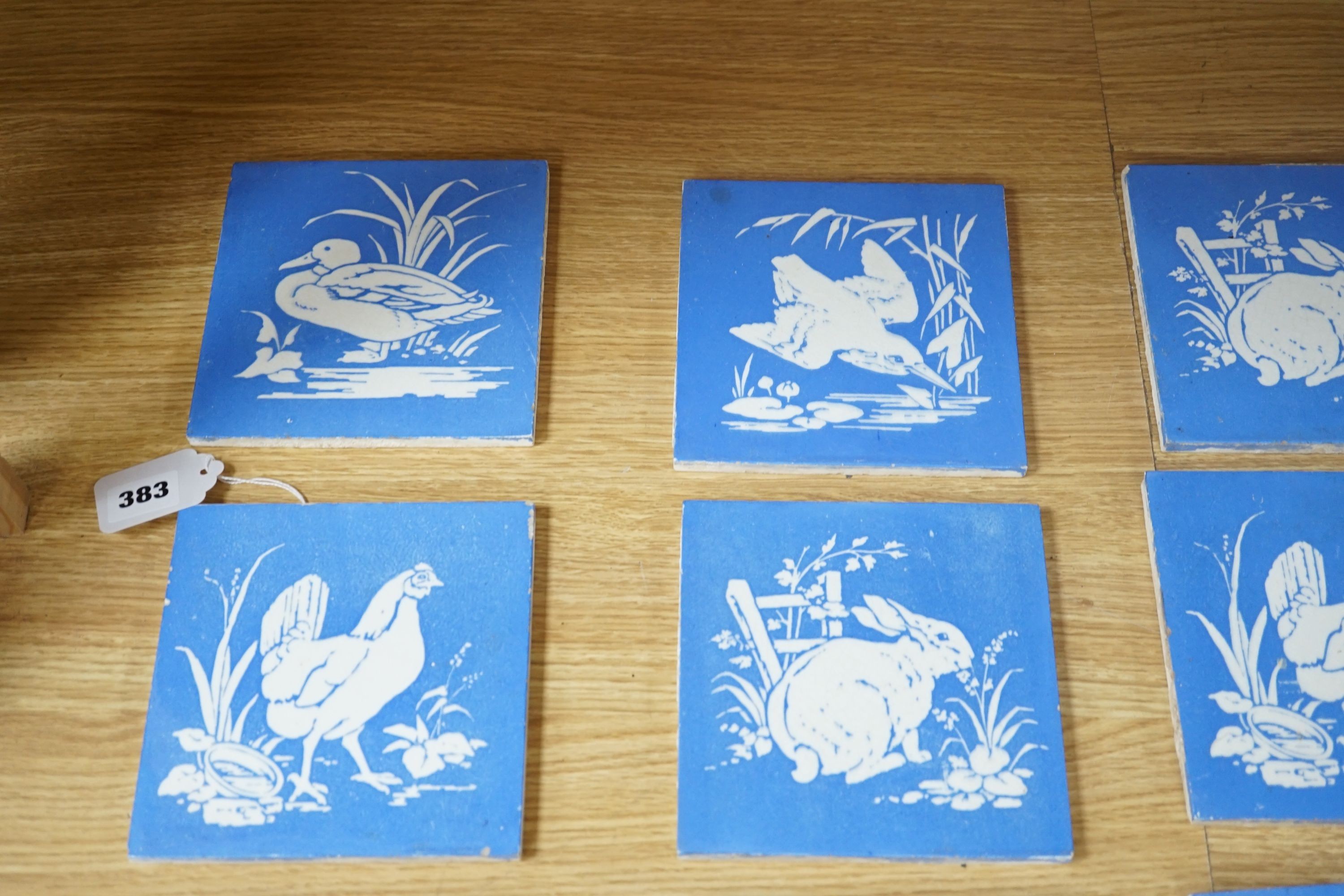 A collection of twelve Mintons China Works blue and white bird tiles, 15cms x 15cms square (each tile).
